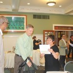 Dean Grant and the committee members preparing for their presentation